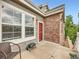 Cozy patio with a red door, brick accent wall, and room for seating at 16366 E Fremont Ave # 11, Aurora, CO 80016