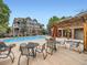 Community pool area featuring a swimming pool, lounge seating, a covered pergola, and a hot tub at 16366 E Fremont Ave # 11, Aurora, CO 80016
