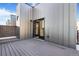 Balcony with gray decking and a view of the home's modern exterior at 5745 W 91St Ave, Westminster, CO 80031