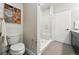 Stylish bathroom boasts a toilet, shower with a glass door, and modern vanity at 6619 E Lowry Blvd # 101, Denver, CO 80230