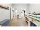 ' bedroom with a loft bed, storage, and access to the bathroom and walk-in closet at 6619 E Lowry Blvd # 101, Denver, CO 80230