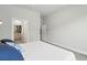 A bright bedroom boasting neutral paint, carpet, walk-in closet and comfortable queen size bed at 6619 E Lowry Blvd # 101, Denver, CO 80230