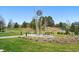 Picturesque community park featuring lush green lawns, walking paths, and a decorative metal sculpture at 6619 E Lowry Blvd # 101, Denver, CO 80230
