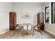 Dining room features modern table, stylish chairs and decorative cabinetry for a refined look at 6619 E Lowry Blvd # 101, Denver, CO 80230