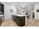 Modern kitchen with stainless appliances, an island, and lots of cabinets offers an open concept layout at 6619 E Lowry Blvd # 101, Denver, CO 80230