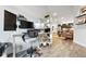 Bright room with ergonomic workspace, round table with chairs and open concept views at 6619 E Lowry Blvd # 101, Denver, CO 80230