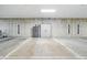 Well-maintained parking space with storage cabinet, safe, and clearly marked lines at 6619 E Lowry Blvd # 101, Denver, CO 80230