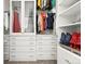 Well-organized walk-in closet featuring built-in shelves, drawers, and hanging rods at 6619 E Lowry Blvd # 101, Denver, CO 80230
