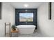 This is a luxurious bathroom with a soaking tub and beautiful tiling at 7267 Comanche Ct, Larkspur, CO 80118
