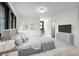 Cozy bedroom with a large bed, modern furnishings, and abundant natural light at 7267 Comanche Ct, Larkspur, CO 80118
