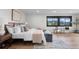 This is a spacious bedroom with natural light and a window view at 7267 Comanche Ct, Larkspur, CO 80118
