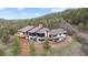 Beautiful exterior of a modern home with white siding, black trim, expansive windows, and a large deck at 7267 Comanche Ct, Larkspur, CO 80118