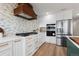 Well-equipped kitchen boasts stainless steel appliances, custom cabinetry, and a decorative backsplash at 7267 Comanche Ct, Larkspur, CO 80118