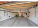Well-organized garage featuring an epoxy floor, storage cabinets, and ample space for vehicles at 1015 Nob Hill Rd, Evergreen, CO 80439