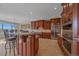 Well-appointed kitchen features granite countertops, custom cabinetry, and modern appliances at 1015 Nob Hill Rd, Evergreen, CO 80439