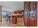Elegant kitchen with custom wood cabinetry, granite counters, and stainless steel appliances at 1015 Nob Hill Rd, Evergreen, CO 80439