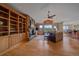 Inviting living room boasts a stone fireplace, hardwood floors and scenic mountain views at 1015 Nob Hill Rd, Evergreen, CO 80439