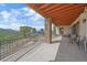 Spacious outdoor patio with views of mountains and wooded area, designed for entertainment and relaxation at 1015 Nob Hill Rd, Evergreen, CO 80439