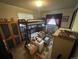 Bedroom with a loft bed above a crib and closet, providing a fun and functional space at 11798 Sidney Rd, Golden, CO 80403