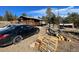 Exterior view of a charming home with wood siding and a large porch at 11798 Sidney Rd, Golden, CO 80403