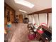 Cozy living room with wood paneling, skylights, and ample natural light at 11798 Sidney Rd, Golden, CO 80403