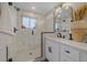 Modern bathroom with marble walk-in shower, sleek fixtures, and stylish decor at 2430 Ames St, Edgewater, CO 80214