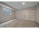 Cozy bedroom features neutral carpeting, ample natural light from a window, and a double door closet at 2430 Ames St, Edgewater, CO 80214