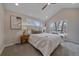 Cozy bedroom featuring vaulted ceiling, natural light, and comfortable decor at 2430 Ames St, Edgewater, CO 80214