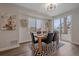 Stylish dining area with hardwood floors, modern table set, and ample natural light at 2430 Ames St, Edgewater, CO 80214