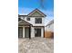 Modern two-story home with white siding, black trim, and a well-maintained front yard at 2430 Ames St, Edgewater, CO 80214