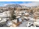 Aerial view of house and snow covered landscape at 810 Meadow Run, Golden, CO 80403