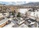 Aerial view of community with houses and snowy landscape at 810 Meadow Run, Golden, CO 80403