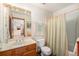 Bathroom with single sink vanity and shower/tub combo at 810 Meadow Run, Golden, CO 80403