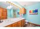 Bathroom features double sinks, a shower, and a skylight at 810 Meadow Run, Golden, CO 80403