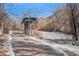 Paved path alongside a frozen creek in winter at 810 Meadow Run, Golden, CO 80403