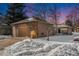 House exterior view with snow covered front yard at 810 Meadow Run, Golden, CO 80403