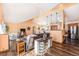 Open concept living room with hardwood floors and kitchen access at 810 Meadow Run, Golden, CO 80403