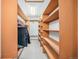 Spacious walk-in closet with custom shelving and hanging rods at 810 Meadow Run, Golden, CO 80403