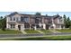 Charming townhomes feature modern architecture, complemented by well-maintained landscaping for enhanced curb appeal at 2012 S Haleyville Way, Aurora, CO 80018