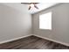 Serene bedroom space with natural light, sleek wood floors, and neutral walls, creating a peaceful ambiance at 2648 Mayotte Way, Castle Rock, CO 80109