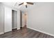 This bedroom offers wood floors, closet with white door, and a ceiling fan at 2648 Mayotte Way, Castle Rock, CO 80109