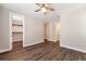Bedroom featuring wood floors and access to walk-in closet at 2648 Mayotte Way, Castle Rock, CO 80109