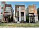 Modern townhouses with unique color schemes, landscaping, and inviting curb appeal in a well maintained community at 2648 Mayotte Way, Castle Rock, CO 80109