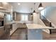 Modern kitchen featuring stainless steel appliances, a spacious island, and ample cabinet space for storage at 2648 Mayotte Way, Castle Rock, CO 80109