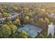 Aerial view of community tennis courts, pool, and building at 1900 E Girard Pl # 608, Englewood, CO 80113