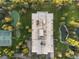 Top-down view of building, landscaping, and tennis courts at 1900 E Girard Pl # 608, Englewood, CO 80113