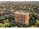 High-rise building aerial view, surrounded by trees and houses at 1900 E Girard Pl # 608, Englewood, CO 80113