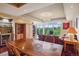 Dining area with wooden table and chairs and views of the living room at 1900 E Girard Pl # 608, Englewood, CO 80113