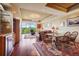 Dining area with wooden table and chairs, adjacent to living room at 1900 E Girard Pl # 608, Englewood, CO 80113