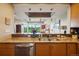 Kitchen featuring stainless steel appliances, stone countertops and scenic view from sink at 1900 E Girard Pl # 608, Englewood, CO 80113